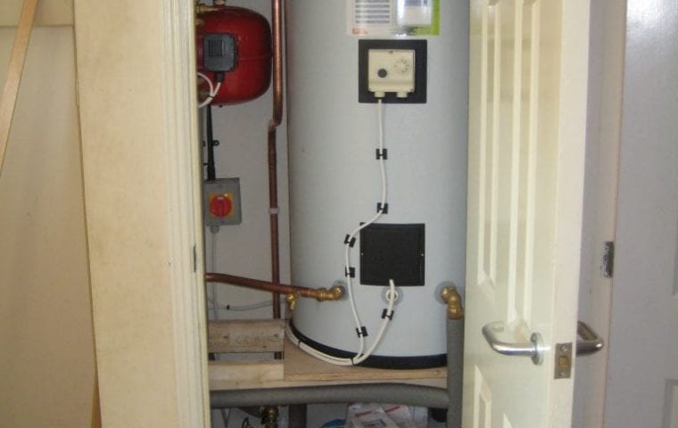 Kensa Ground Source Heat Pump Review: Social Housing - Flagship Housing. The Shoebox and new hot water cylinder in the airing cupboard.