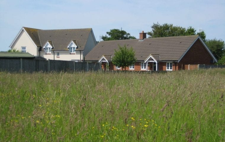 Kensa Ground Source Heat Pump Review: Social Housing - Flagship Housing. The two semi-detached houses and the two bungalows (Array 5) demonstrate the rural location at Fressingfield.