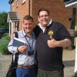 Kensa Ground Source Heat Pump Review: Social Housing - (L) Matt Smith (Flagship) and (R) Mr Streater (tenant) outside the flats and house which share a Kensa micro ground source heat network.