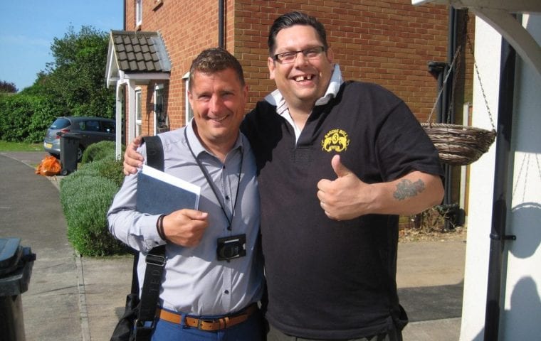 Kensa Ground Source Heat Pump Review: Social Housing - (L) Matt Smith (Flagship) and (R) Mr Streater (tenant) outside the flats and house which share a Kensa micro ground source heat network.