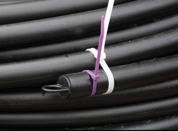 Ground source heat pump coiled slinky pipe - purple