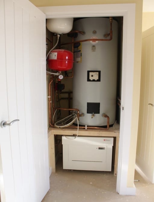 Kensa heat pumps shoebox in cupboard