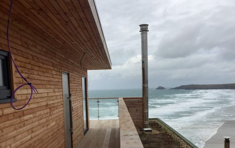 Silver Spray ground source heat pump case study: view of Perranporth beach from decking