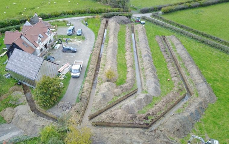 Brick Cottage ground source heat pump case study: aerial view completed slinky trenches