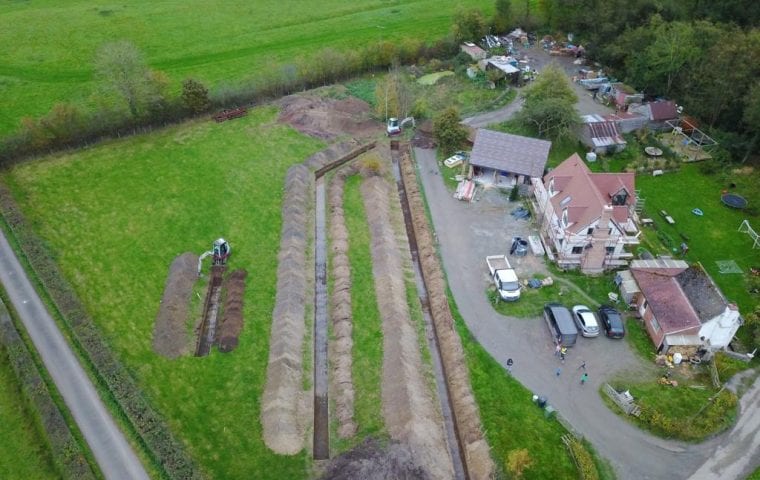 Brick Cottage ground source heat pump case study: aerial view digging the third slinky trench
