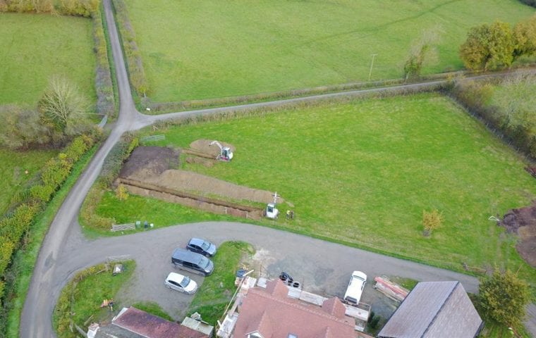 Brick Cottage ground source heat pump case study: aerial view beginning to dig the slinky trenches