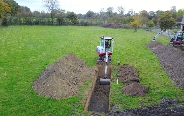 Brick Cottage ground source heat pump case study: digger excavates slinky trench