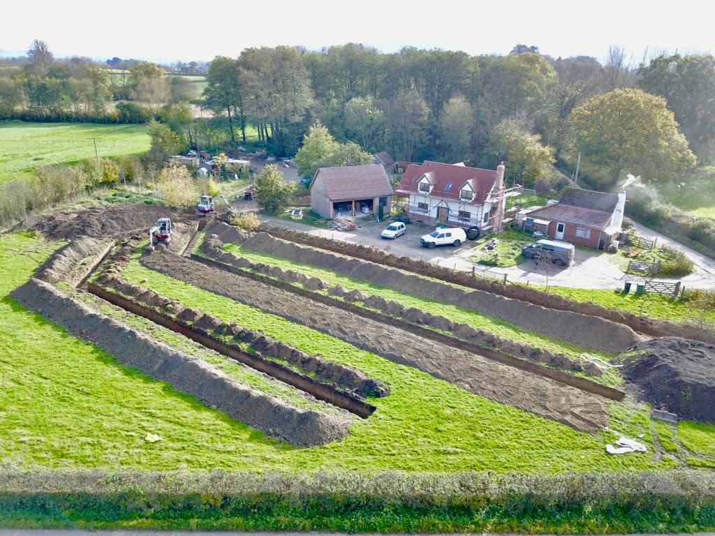 Brick Cottage ground source heat pump case study: front on view of slinky trenches