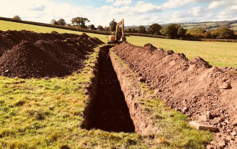 Clifford Place ground source heat pump case study: slinky trench being dug