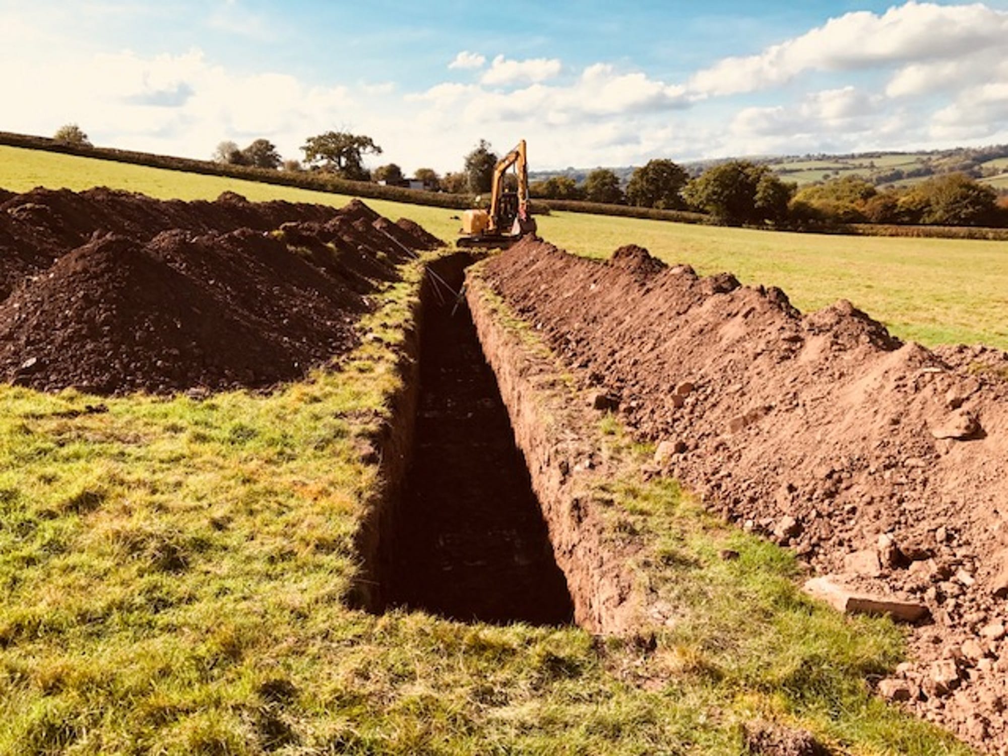 Clifford Place ground source heat pump case study: slinky trench being dug