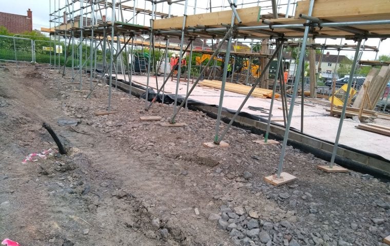 Tuckers Close ground source heat pump case study: groundworks scaffolding close up