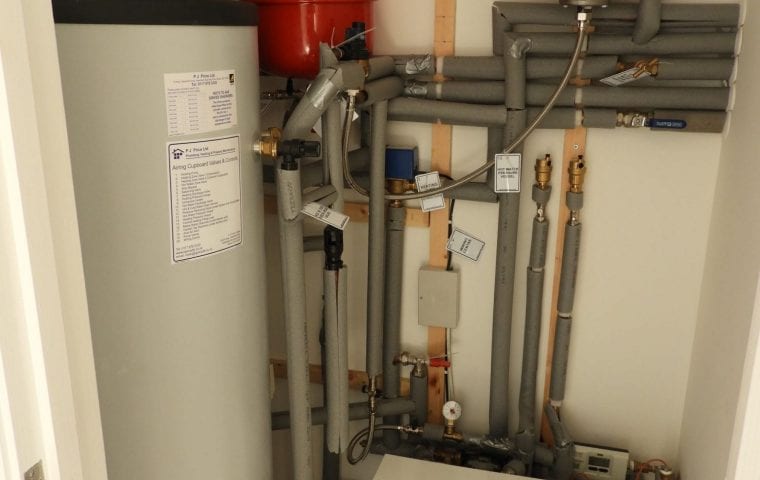 Tuckers Close ground source heat pump case study: Shoebox in understairs cupboard