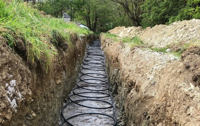 Ground source slinky trenches