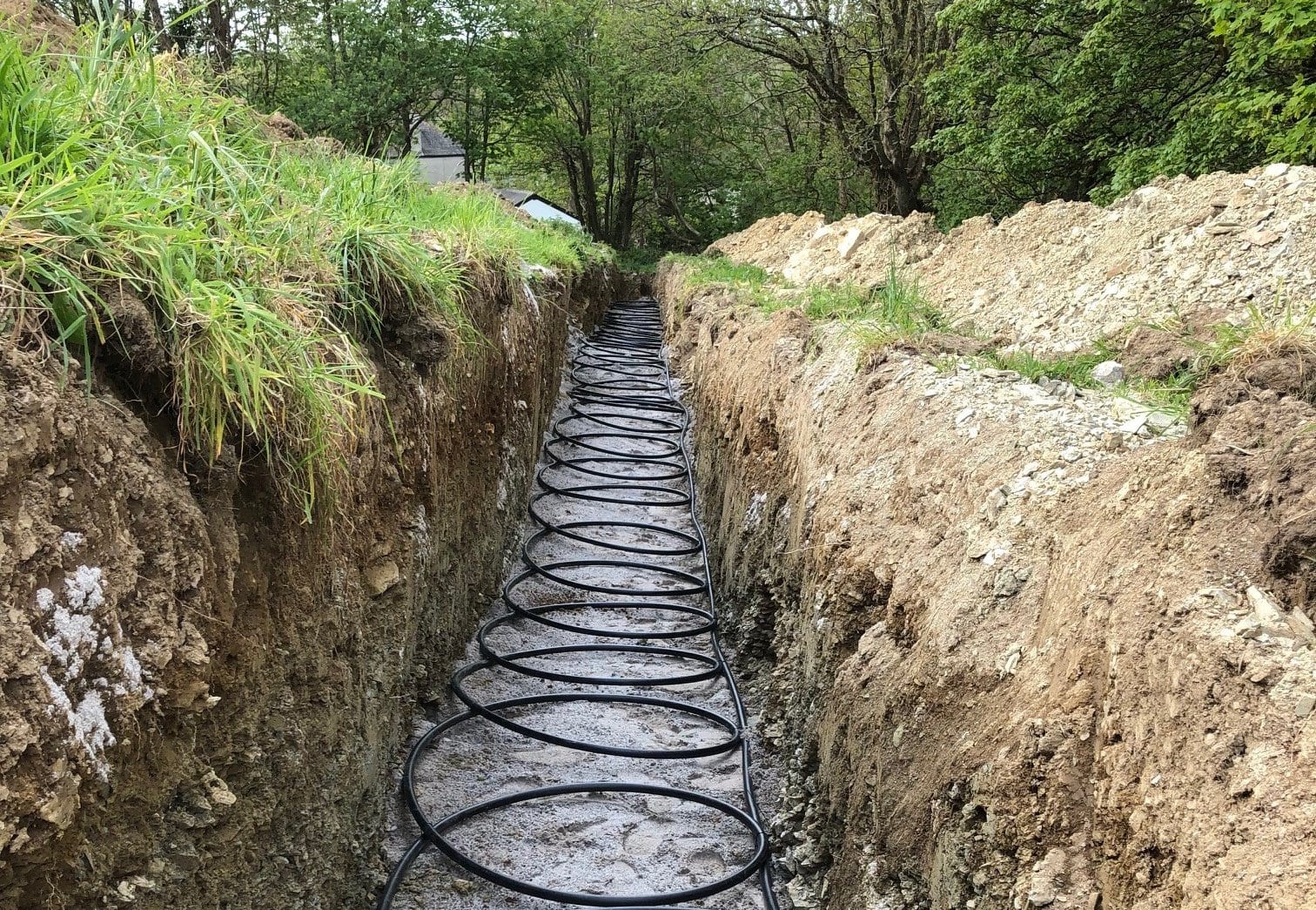 Ground source slinky trenches